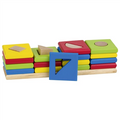Colorful wooden shape blocks with a blue triangle block on a white background