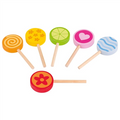 Set of colorful wooden lollipops on sticks against a white background
