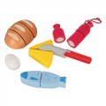 Set of toy kitchen items including a bread loaf, eggs, cheese, knife, and fish on a white background