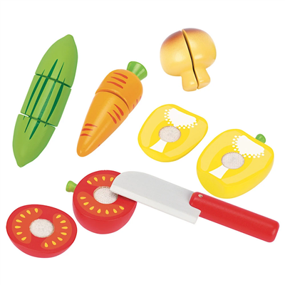 Set of toy kitchen vegetables and utensils on a white background
