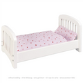 White doll bed with pink heart-patterned bedding on a white background