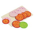 Colorful toy pizza with various toppings on a white background
