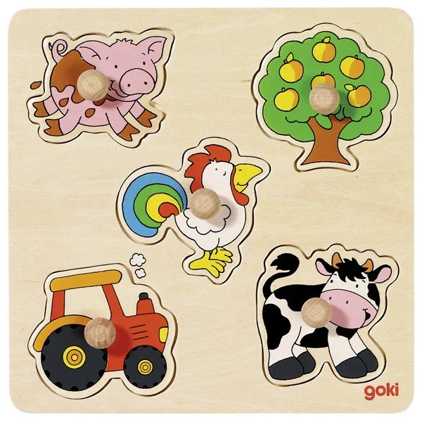 Wooden puzzle with farm animal figures and a tree, featuring the brand 'goki'.