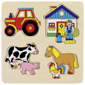 Wooden puzzle with farm animal and tractor pieces on a beige background