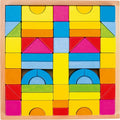 Colorful wooden blocks in various shapes and sizes on a wooden board