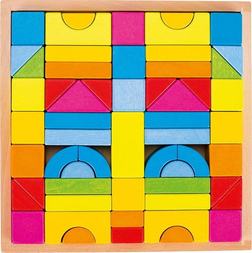 Colorful wooden blocks in various shapes and sizes on a wooden board