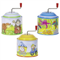 Three colorful tin canisters with cartoon designs on a white background