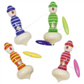 Set of colorful wooden spinning tops with clown faces on a white background