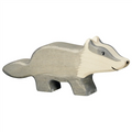 Wooden badger figure on a white background