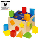 Colorful wooden shape sorting toy with geometric blocks on a white background, featuring a German Sustainability Award label.
