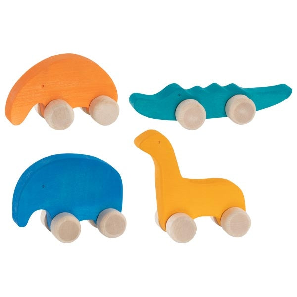 Set of four colorful wooden toys on wheels against a white background