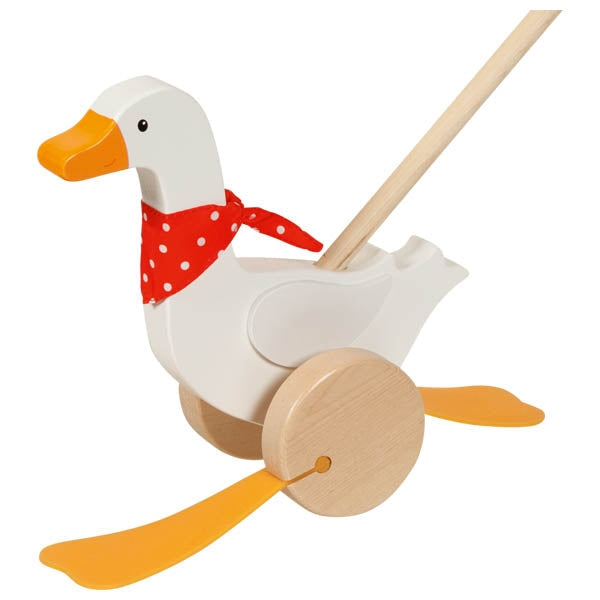 Wooden toy goose with a red bandana on a white background