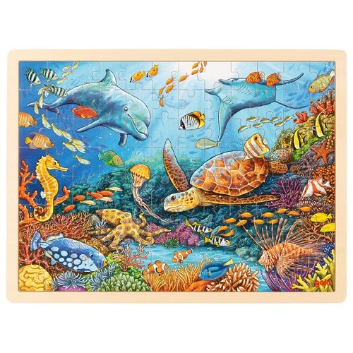 Wooden puzzle with an underwater scene featuring dolphins, turtles, and various sea creatures.