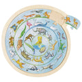 Circular animal puzzle with wooden frame on a white background