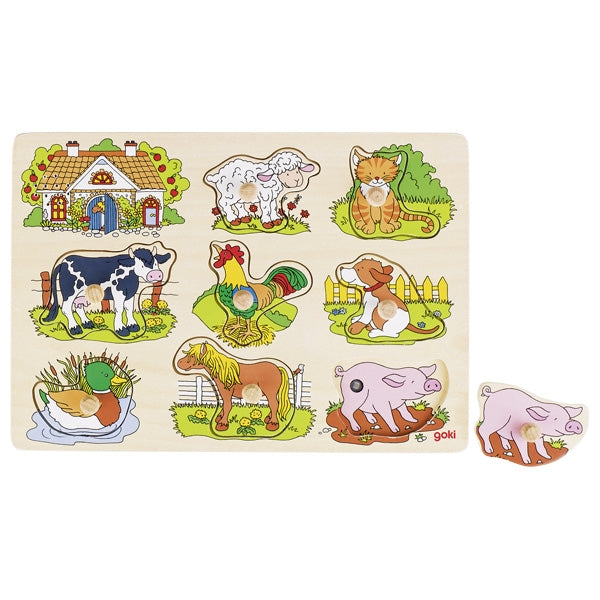 A wooden sound puzzle featuring farm animals with a cow, horse, pig, dog, and cat, along with a piece for a mouse not yet placed in the puzzle.
