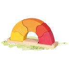 Colorful wooden arch toy on a white background