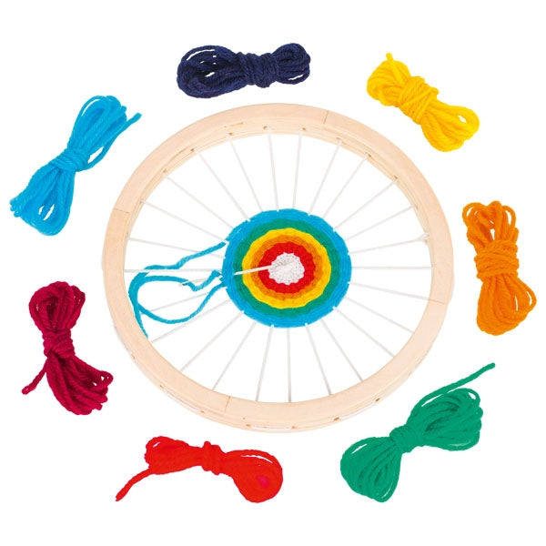 Colorful lacing wheel with various colored strings on a white background