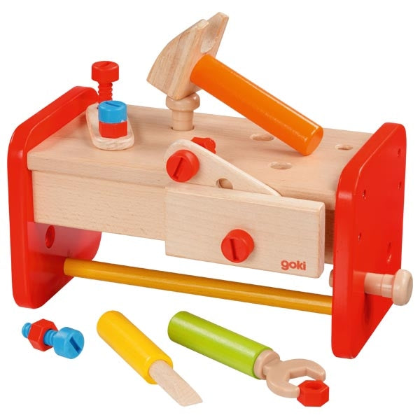 Toy workbench with tools on a white background