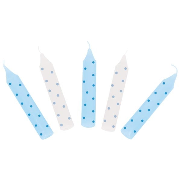 Five birthday candles with blue and white polka dots on a white background