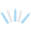 Five birthday candles with blue and white polka dots on a white background