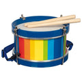 Colorful striped drum with blue rim and wooden sticks on a white background