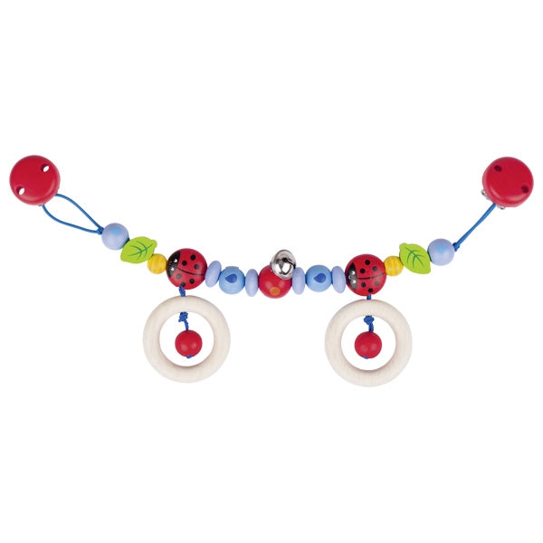 Colorful baby teething toy with beads and rings on a white background