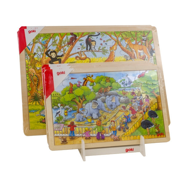 Two children's puzzles with colorful illustrations of animals and people, featuring the brand 'goki'.