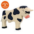 Wooden cow toy with black spots on a white background, featuring the Spiel Gur logo.