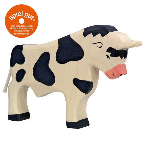 Wooden cow toy with black spots on a white background, featuring the Spiel Gur logo.