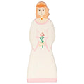 Wooden doll with a dress featuring a rose design on a white background