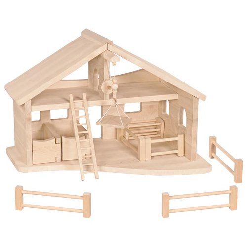 Wooden toy barn set with stable and fences on a white background