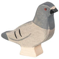Wooden pigeon figurine on a white background